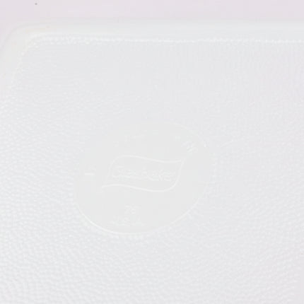 Plat à four carré Glasbake en opaline blanc avec motif floral vert