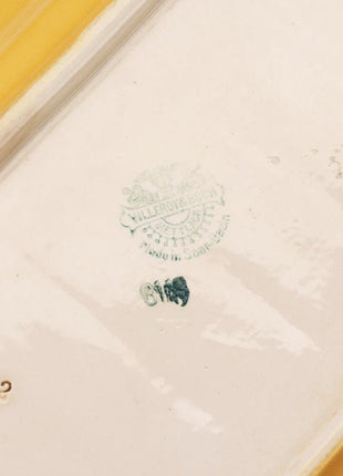 Plat de service Villeroy & Boch blanc cassé et liseret noir et jaune