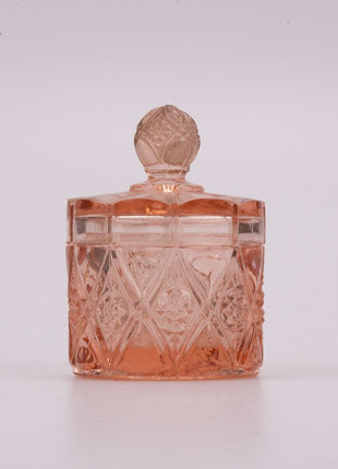 Petit pot rose en verre transparent avec couvercle