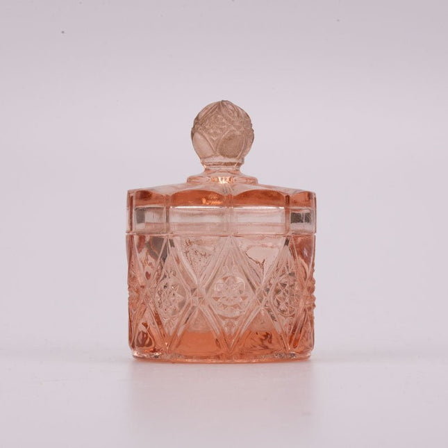 Petit pot rose en verre transparent avec couvercle