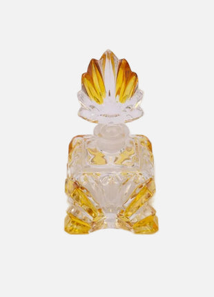 Flacon de parfum élégant en verre jaune et transparent