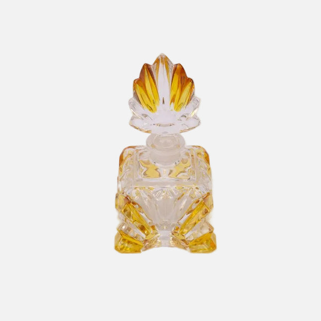 Flacon de parfum élégant en verre jaune et transparent
