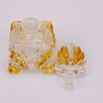 Flacon de parfum élégant en verre jaune et transparent