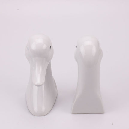 2 serre-livres canard blanc en porcelaine Hier Vullen met Zand