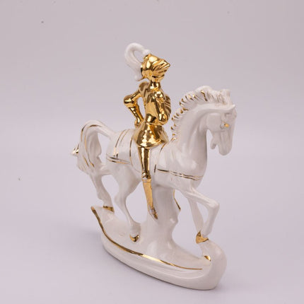 Cavalier sur son cheval en porcelaine blanc et doré