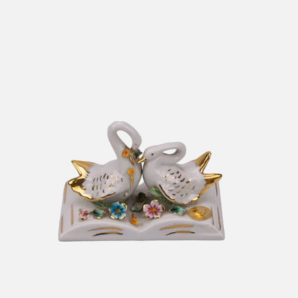 Couple de cygnes en porcelaine blanc et doré