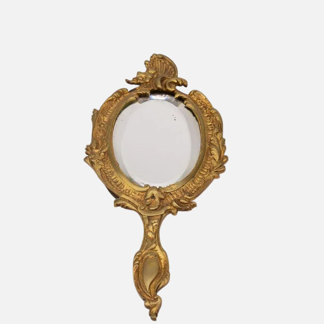 Miroir ancien face à main en bronze doré