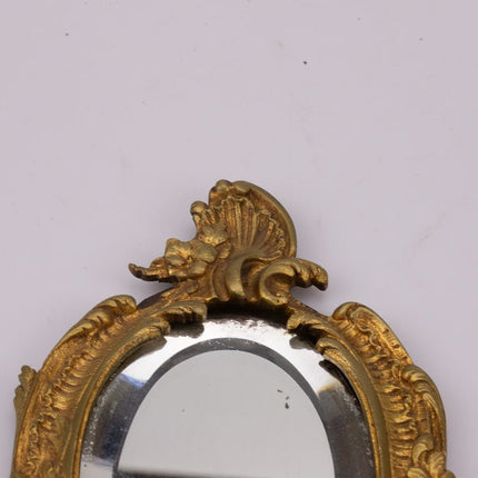 Miroir ancien face à main en bronze