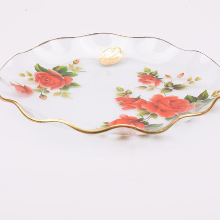 Plat en verre transparent au bord doré et motifs fleuris rouges