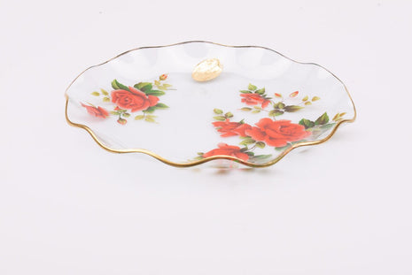 Plat en verre transparent au bord doré et motifs fleuris rouges