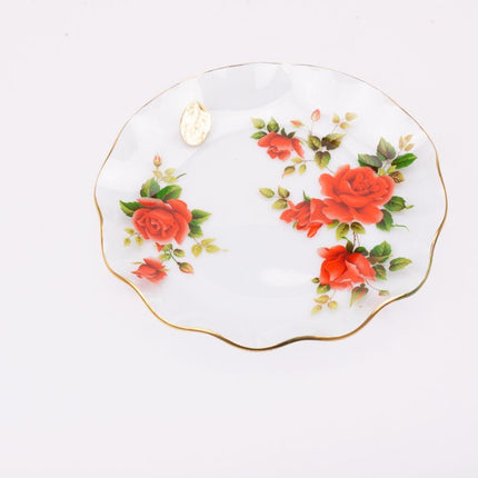 Plat en verre transparent au bord doré et motifs fleuris rouges