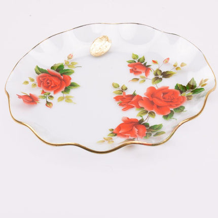Plat en verre transparent au bord doré et motifs fleuris rouges
