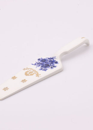 Pelle à tarte en porcelaine blanche avec motif floral bleu