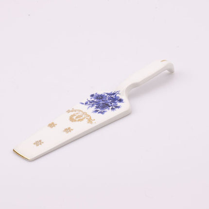 Pelle à tarte en porcelaine blanche avec motif floral bleu