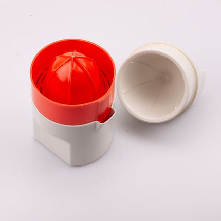 Presse-agrumes en plastique blanc et orange