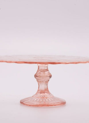 Présentoir à gateaux en verre rose sur pied
