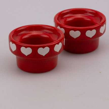 2 bougeoirs vintage rouges avec des cœurs