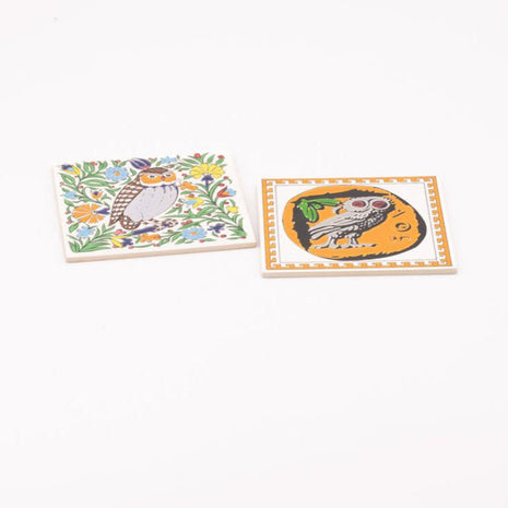 2 dessous de plats en faïence illustré avec des hiboux
