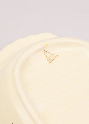 Plat de service vintage jaune et blanc en faïence 