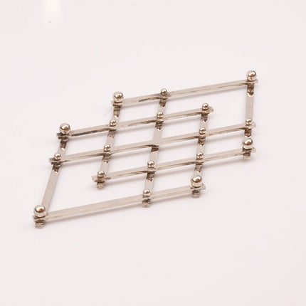 Dessous de Plat Extensible en Acier Inoxydable | Pliable et Ajustable
