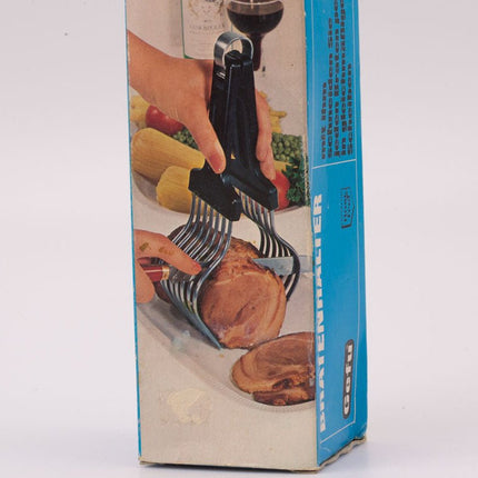 Pince à roti en métal argenté et manche noir
