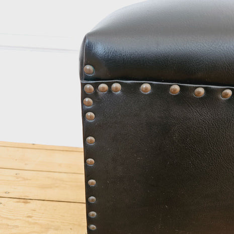 Pouf vintage noir en cuir