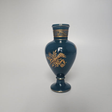 Petit vase bleu et or en porcelaine avec élégants motifs floraux