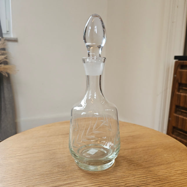 Finely cut, clear glass carafe
